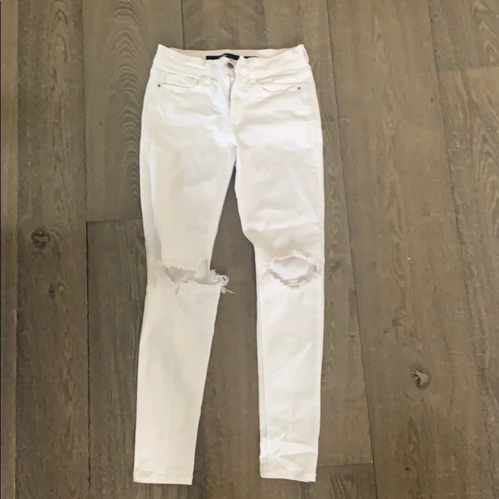 Ripped knee white jeans